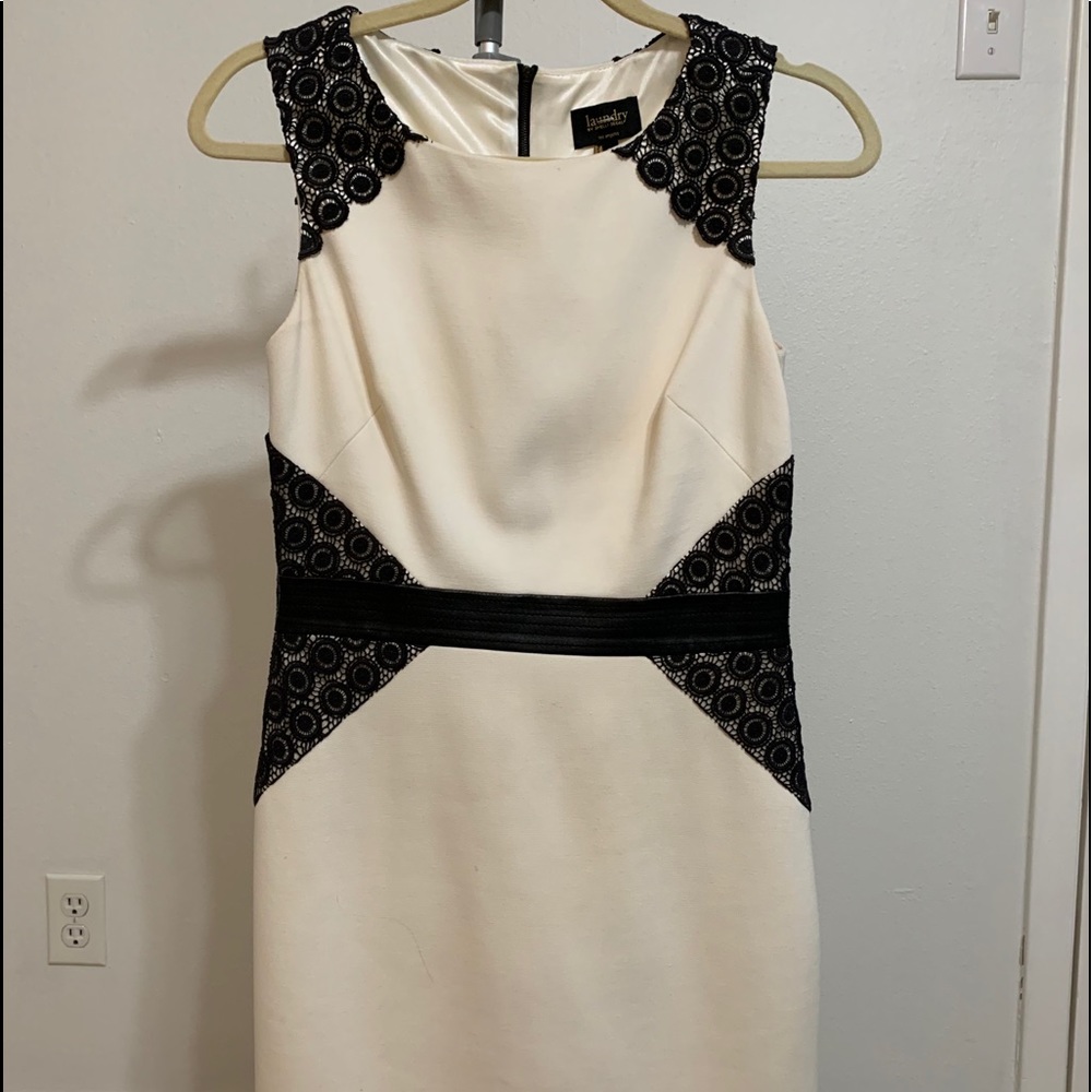 Cream and black cocktail dress.